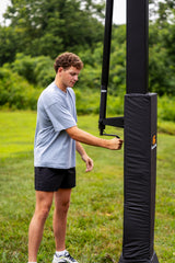 Person adjusting a Goalrilla basketball hoop