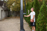 Goalrilla In Ground Basketball Goal - CV54 - 54" Backboard - Man using height adjustability crank