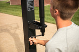 54 inch In Ground Basketball hoop - FT54 - 54" Backboard - Guy Adjusting Height with Crank Handle