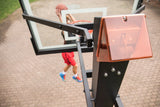 Goalrilla STBLZR Box — 60" CV - Left Side Top View with Kid Shooting Basketball