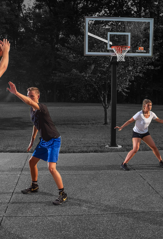 Goalrilla in ground basketball hoop with basketball players