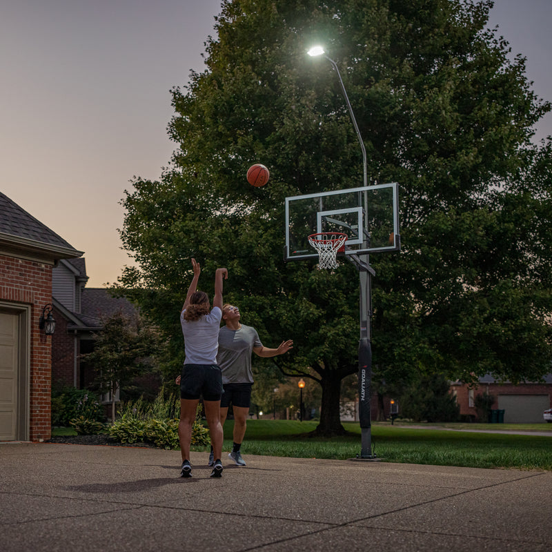 Goaliath LED Basketball Hoop Light - Two Kids Playing Basketball at Night