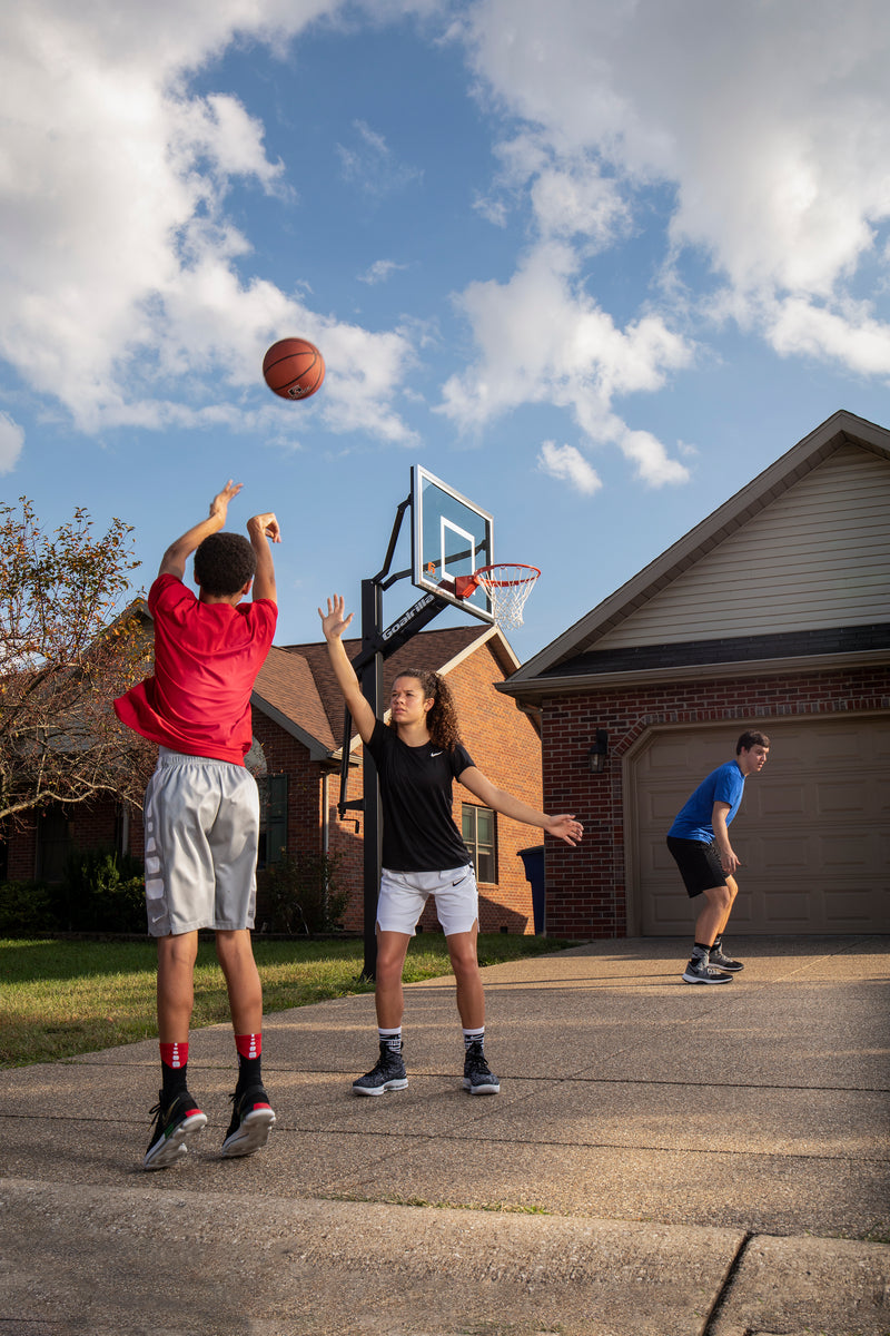 Goalrilla In Ground Basketball Goal - GS54C - 54" Backboard - Kids Playing on Home Court