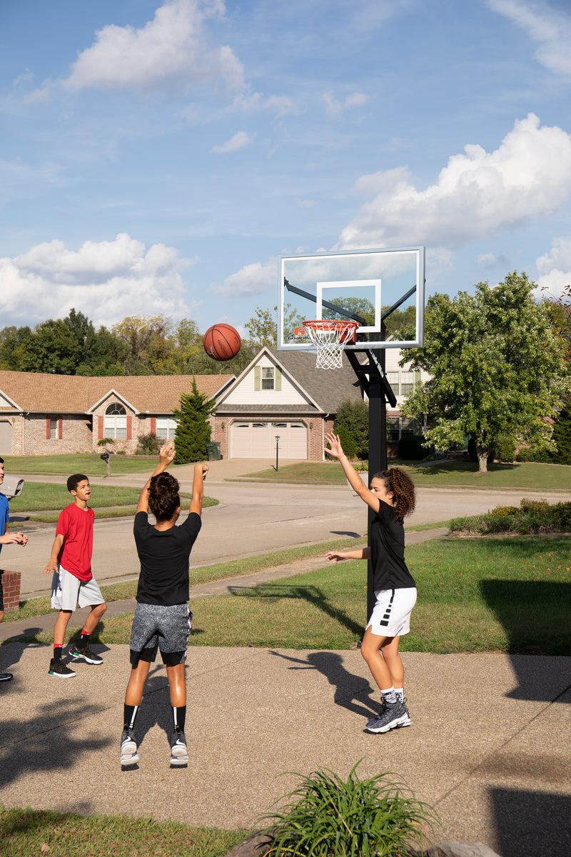 Goalrilla In Ground Basketball Goal - GS54C - 54" Backboard - Kids Playing on Home Court