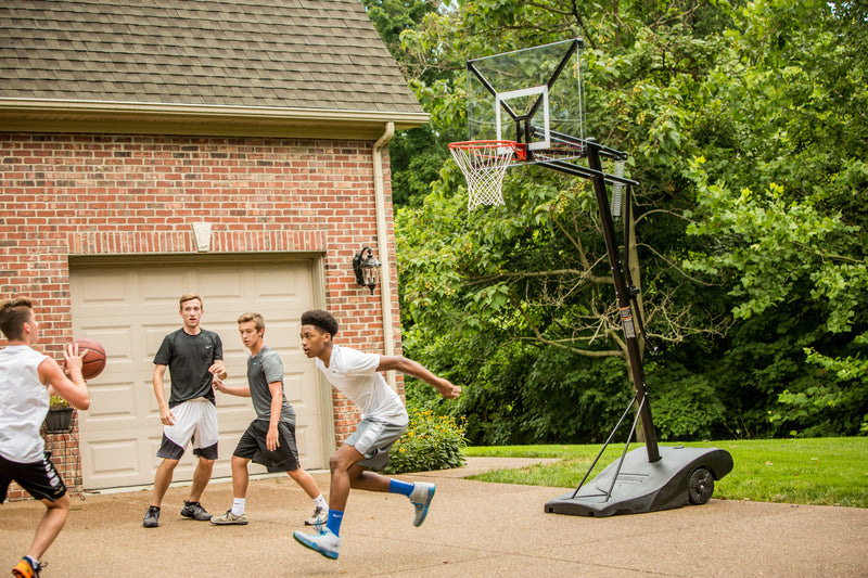 Silverback NXT 50 Portable Basketball Goal - Kids Playing on Home Court Portable Hoop